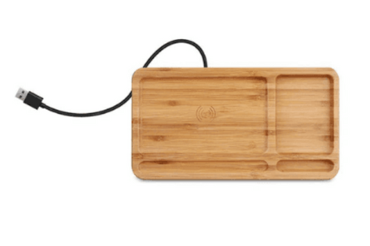 Eco-friendly Bamboo Charger with USB cable; minimalist wireless charging station with multiple compartments for accessories and devices.