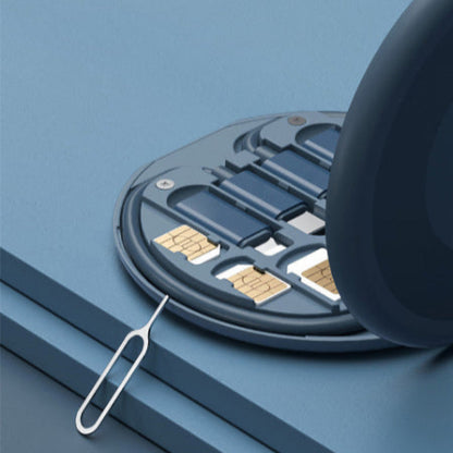 SIM card tray with two SIM cards and a metal eject tool on a blue background