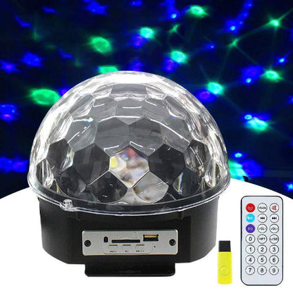 Crystal LED light ball illuminating party room with swirling colors