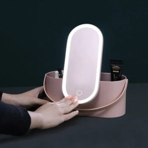 Foldable LED mirror box featuring ring lights around the mirror and compartments for brushes and products.