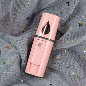 Pink electronic device with black accents on a sheer fabric background