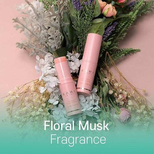 Two pink floral musk fragrance bottles with a bouquet of flowers on a gradient background.
